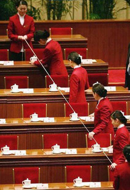 Checking the alignment of the tea cups, Japanese parliament