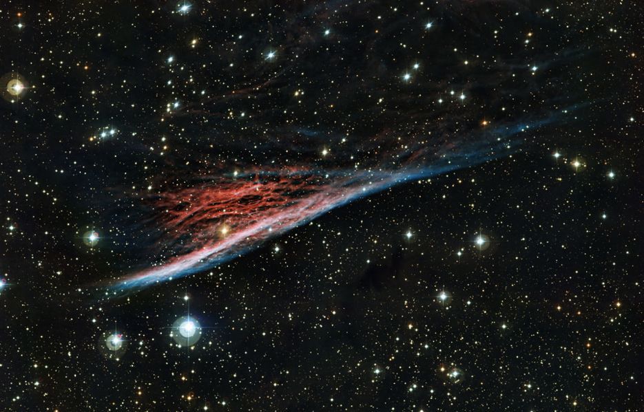 ESO, Chile, the Pencil Nebula. This vibrant red and blue is part of a ring of wreckage resulting from a supernova explosion that occurred 11,000 years ago.