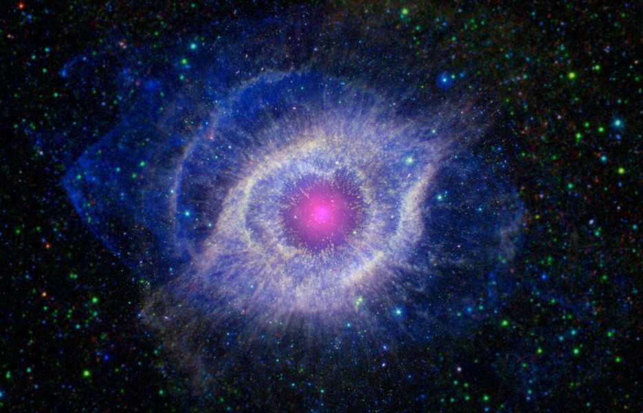 Helix nebula, the remains of a dying star, NASA's Spitzer Space Telescope and Galaxy Evolution Explorer, the star's dusty outer layers glow from ultraviolet radiation.