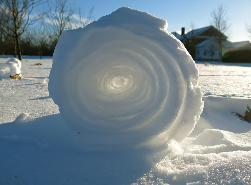 A snow roller is a rare meteorological phenomenon in which large snowballs are formed naturally as chunks of snow are blown along the ground by wind, picking up material along the way, in much the same way that the large snowballs used in snowmen are made.