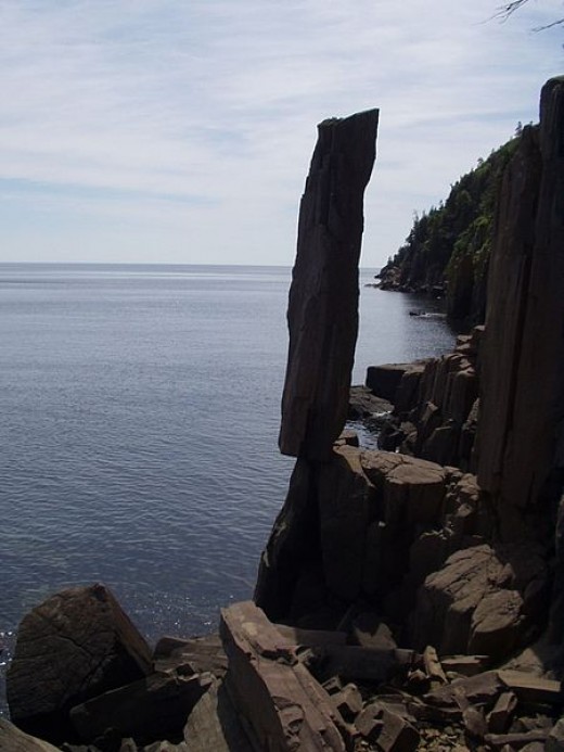 Balancing Rock on Long Island at Digby Neck, Nova Scotia, Canada. Image by Joan Anderson on flickr. Standing for thousands of years balancing rock defies erosion. It's about 30 feet or 9 meters in height.