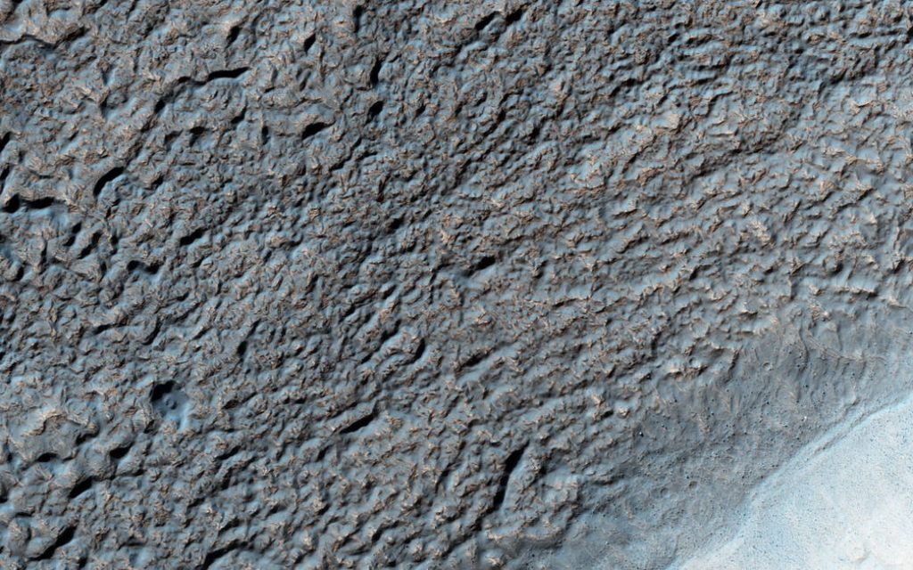 This image of Solis Planum — a huge mound south of the Mars canyon system Valles Marineris - was acquired by the HiRISE camera on NASA's Mars Reconnaissance Orbiter on Aug. 16, 2015, at 2:47 p.m. local Mars time.